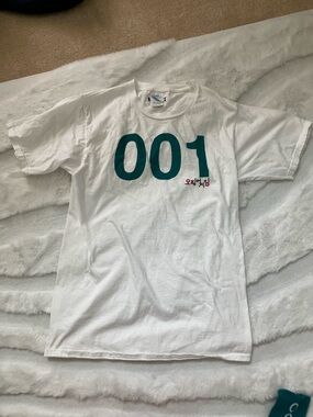 Netflix White T-Shirt with Teal "001" Print with matching socks
